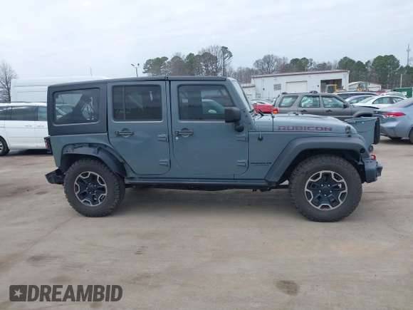 2015 Jeep Wrangler Unlimited Rubicon Hard Rock z VIN 1C4HJWFG1FL679873, wystawiony jako IAAI lot #41508722 z przebiegiem 97 165 mil mil oraz . Historia ofert i sprzedaży dostępna na DreamBid. Obrazek 13.