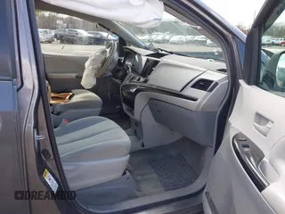 2014 Toyota Sienna L with VIN 5TDZK3DC4ES407928, listed as a IAAI auction lot 41887349 with 208,289 mi miles. Bid and sale history available at carsss.com. Image 5.