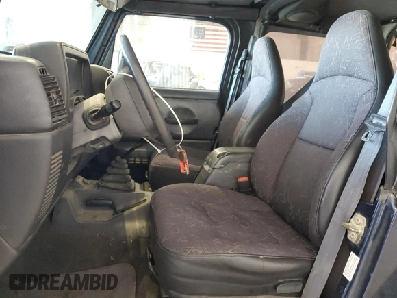 2002 Jeep Wrangler Sport with VIN 1J4FA49S82P713459, listed as a Copart auction lot 52745955 with 173,297 mi miles and Salvage Title. Bid and sale history available at carsss.com. Image 7.