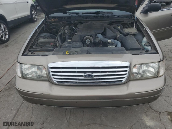 2005 Ford Crown Victoria LX with VIN 2FAFP74W95X147431, listed as a Copart auction lot 73487374 with 203,107 mi miles and Non Repairable. Bid and sale history available at carsss.com. Image 11.
