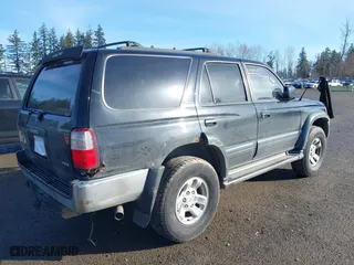 1997 Toyota 4Runner Limited with VIN JT3HN87R1V0079567, listed as a IAAI auction lot 41725597 with 291,662 mi miles. Bid and sale history available at carsss.com. Image 4.