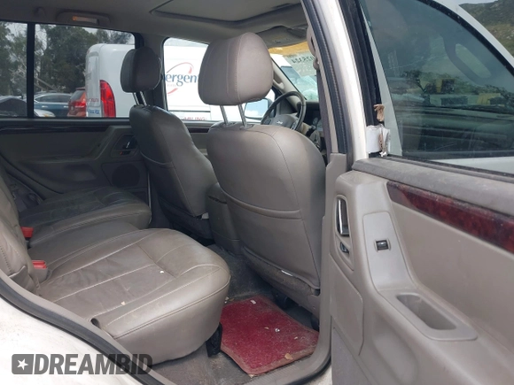 2002 Jeep Grand Cherokee Limited with VIN 1J4GX58S52C305020, listed as a IAAI auction lot 42025324 with 214,214 mi miles and . Bid and sale history available at DreamBid. Image 8.