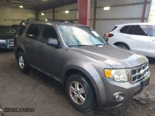 2010 Ford Escape XLT with VIN 1FMCU9D70AKD21499, listed as a IAAI auction lot 42039437 with 185,545 mi miles. Bid and sale history available at carsss.com. Image 1.