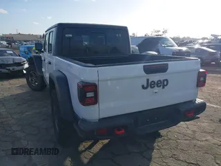 2023 Jeep Gladiator Rubicon z VIN 1C6JJTBG5PL566958, wystawiony jako IAAI lot #42298811 z przebiegiem 18 568 mil mil oraz . Historia ofert i sprzedaży dostępna na DreamBid. Obrazek 3.