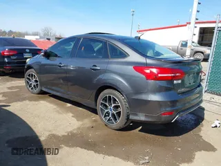 2015 Ford Focus SE with VIN 1FADP3F29FL268677, listed as a IAAI auction lot 42037244 with 118,018 mi miles. Bid and sale history available at carsss.com. Image 3.