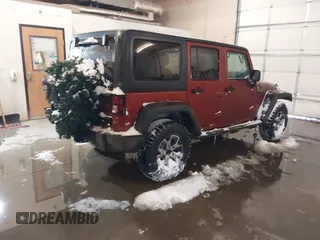 2014 Jeep Wrangler Unlimited Sport with VIN 1C4BJWDG6EL194569, listed as a IAAI auction lot 41549268 with 122,740 mi miles. Bid and sale history available at carsss.com. Image 4.