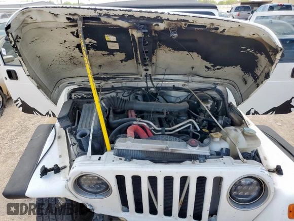 2004 Jeep Wrangler Sport z VIN 1J4FA49SX4P802341, wystawiony jako Copart lot #62752565 z przebiegiem 150 197 mil mil oraz Szkoda całkowita • Salvage title. Historia ofert i sprzedaży dostępna na DreamBid. Obrazek 11.