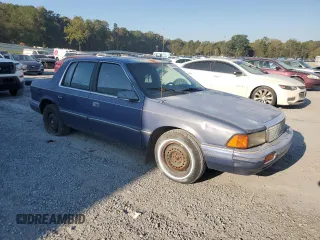 1992 Plymouth Acclaim z VIN 1P3XA46K8NF255561, wystawiony jako Copart lot #74290964 z przebiegiem 126 154 mil mil oraz Szkody całkowita. Historia ofert i sprzedaży dostępna na DreamBid. Obrazek 4.