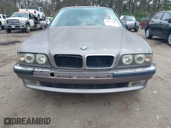 1998 BMW 7 Series 740il with VIN WBAGJ8323WDM23239, listed as a IAAI auction lot 41512630 with 221,673 mi miles. Bid and sale history available at carsss.com. Image 6.