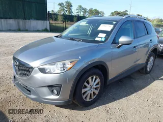 2014 Mazda CX-5 Touring with VIN JM3KE4CY0E0302583, listed as a IAAI auction lot 41947735 with 122,077 mi miles. Bid and sale history available at carsss.com. Image 2.