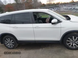 2019 Honda Pilot EX-L with VIN 5FNYF6H59KB075577, listed as a IAAI auction lot 41863841 with 102,242 mi miles and . Bid and sale history available at carsss.com. Image 13.