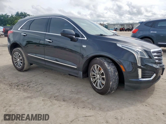 2017 Cadillac XT5 Luxury FWD with VIN 1GYKNBRS3HZ101867, listed as a Copart auction lot 60923215 with 130,209 mi miles and Salvage title. Bid and sale history available at DreamBid. Image 4.
