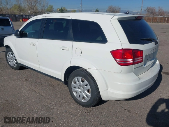 2015 Dodge Journey SE z VIN 3C4PDCAB4FT600293, wystawiony jako IAAI lot #41981386 z przebiegiem 143 573 mil mil oraz . Historia ofert i sprzedaży dostępna na DreamBid. Obrazek 3.