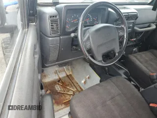 2003 Jeep Wrangler Rubicon z VIN 1J4FA69S53P340085, wystawiony jako Copart lot #74564574 z przebiegiem Nie podano mil oraz Szkoda całkowita • Salvage title. Historia ofert i sprzedaży dostępna na DreamBid. Obrazek 8.