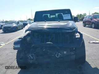 2021 Jeep Gladiator Willys with VIN 1C6HJTAGXML613431, listed as a IAAI auction lot 42180502 with 64,572 mi miles and . Bid and sale history available at DreamBid. Image 12.