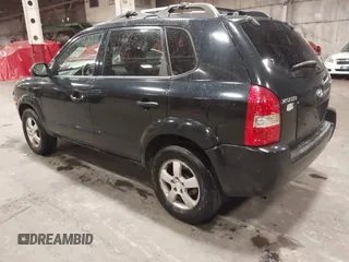 2006 Hyundai Tucson GL with VIN KM8JM12B26U325338, listed as a IAAI auction lot 41809578 with 127,210 mi miles. Bid and sale history available at carsss.com. Image 3.