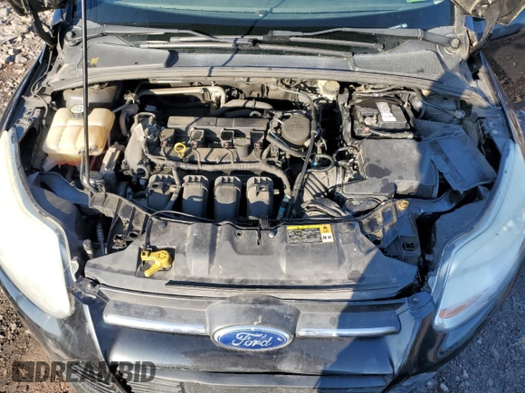 2013 Ford Focus SE z VIN 1FADP3F27DL369634, wystawiony jako Copart lot #61409725 z przebiegiem 122 709 mil mil oraz Szkoda całkowita • Salvage title. Historia ofert i sprzedaży dostępna na DreamBid. Obrazek 11.