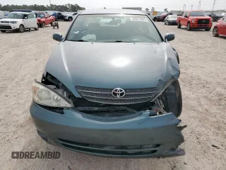 2003 Toyota Camry LE z VIN 4T1BF32K13U554339, wystawiony jako Copart lot #55972595 z przebiegiem 69 549 mil mil oraz Szkoda całkowita • Salvage title. Historia ofert i sprzedaży dostępna na DreamBid. Obrazek 5.