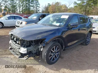 2018 Mazda CX-5 Touring z VIN JM3KFACM0J1389057, wystawiony jako IAAI lot #40922679 z przebiegiem 140 026 mil mil oraz . Historia ofert i sprzedaży dostępna na DreamBid. Obrazek 18.