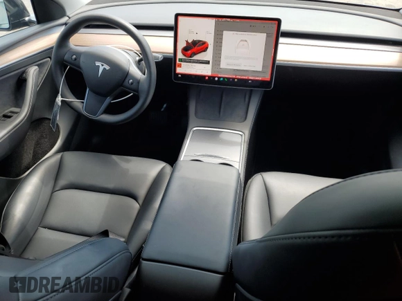2025 Tesla Model Y Long Range with VIN 7SAYGDED8SF241779, listed as a Copart auction lot 51899205 with 12,409 mi miles and Salvage Title. Bid and sale history available at DreamBid. Image 8.
