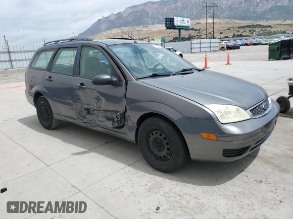 2006 Ford Focus SE with VIN 1FAHP36N56W223049, listed as a Copart auction lot 61211745 with 185,609 mi miles and Salvage title. Bid and sale history available at DreamBid. Image 4.