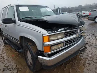 1997 Chevrolet Tahoe with VIN 1GNEK13R0VJ351919, listed as a IAAI auction lot 41028840 with 218,937 mi miles. Bid and sale history available at carsss.com. Image 12.