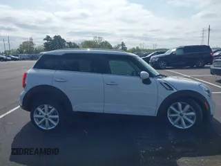 2016 MINI Countryman S with VIN WMWZC3C51GWT10458, listed as a IAAI auction lot 41878799 with 112,019 mi miles and . Bid and sale history available at DreamBid. Image 13.