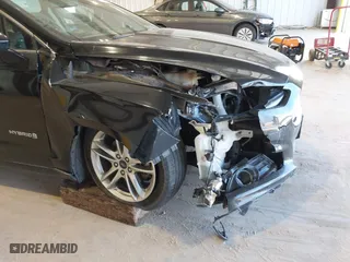 2016 Ford Fusion Titanium Hybrid with VIN 3FA6P0RU7GR127307, listed as a IAAI auction lot 41944427 with 128,076 mi miles. Bid and sale history available at carsss.com. Image 6.