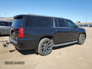 2015 Chevrolet Suburban LTZ with VIN 1GNSKKKC2FR634654, listed as a Copart auction lot 50337415 with 150,255 mi miles and Salvage Title. Bid and sale history available at DreamBid. Image 3.