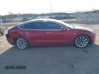 2019 Tesla Model 3 Mid Range with VIN 5YJ3E1EA3KF466418, listed as a IAAI auction lot 41724564 with 53,774 mi miles and . Bid and sale history available at DreamBid. Image 13.