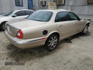 2004 Jaguar XJ with VIN SAJEA74C84SG03857, listed as a Copart auction lot 62156875 with 92,649 mi miles and Salvage title. Bid and sale history available at DreamBid. Image 3.