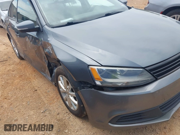 2011 Volkswagen Jetta SE with VIN 3VWDX7AJ4BM330203, listed as a IAAI auction lot 42256889 with 209,557 mi miles and . Bid and sale history available at DreamBid. Image 12.