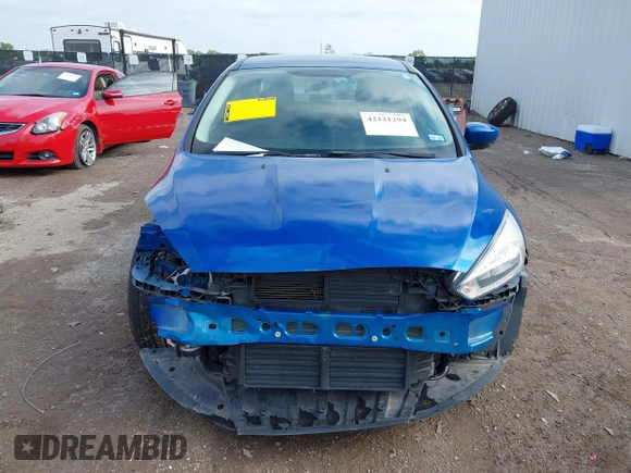 2018 Ford Focus SE z VIN 1FADP3F2XJL293337, wystawiony jako IAAI lot #42121294 z przebiegiem 71 241 mil mil oraz . Historia ofert i sprzedaży dostępna na DreamBid. Obrazek 6.