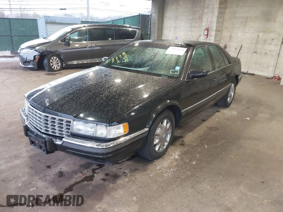 1997 Cadillac Seville Luxury SLS with VIN 1G6KS52YXVU816736, listed as a IAAI auction lot 41854220 with 107,091 mi miles. Bid and sale history available at carsss.com. Image 2.