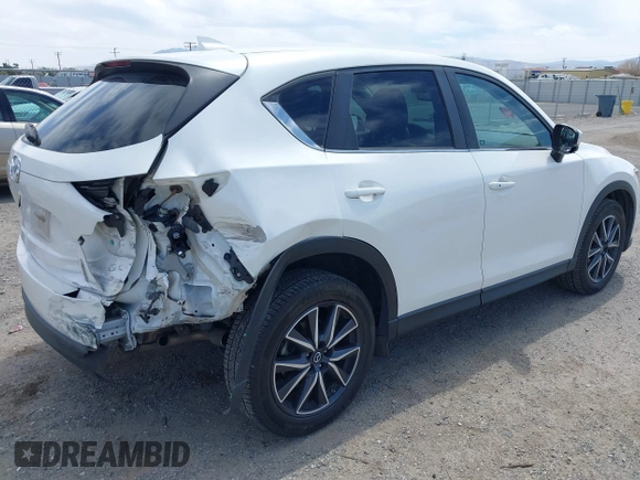 2018 Mazda CX-5 Touring with VIN JM3KFACM3J0381122, listed as a IAAI auction lot 42023838 with 76,121 mi miles. Bid and sale history available at carsss.com. Image 4.