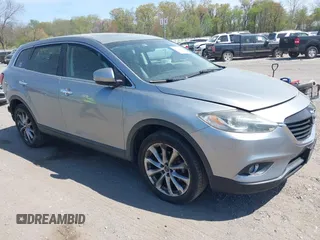 2014 Mazda CX-9 Grand Touring z VIN JM3TB3DV4E0429428, wystawiony jako IAAI lot #42094028 z przebiegiem 147 294 mil mil oraz . Historia ofert i sprzedaży dostępna na DreamBid. Obrazek 1.