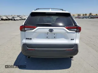 2022 Toyota RAV4 XLE with VIN 2T3W1RFV8NW233397, listed as a Copart auction lot 65276715 with 20,956 mi miles and Salvage title. Bid and sale history available at DreamBid. Image 6.