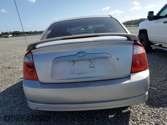 2006 Kia Spectra EX with VIN KNAFE121365229594, listed as a Copart auction lot 77311084 with 129,789 mi miles and Salvage Title. Bid and sale history available at carsss.com. Image 6.