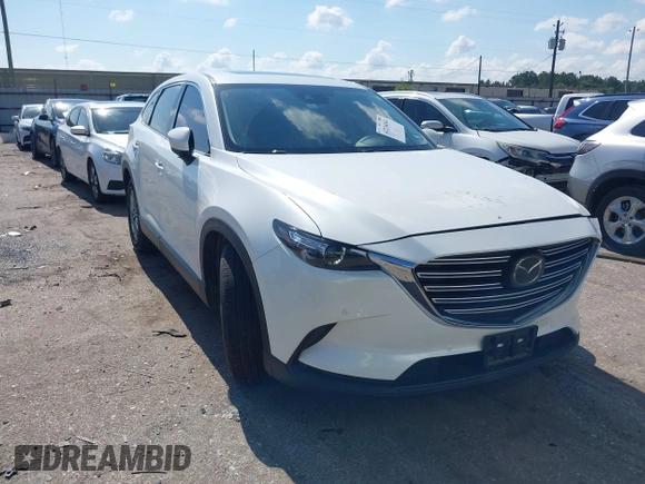 2019 Mazda CX-9 Touring with VIN JM3TCACY7K0314539, listed as a IAAI auction lot 42234361 with 98,299 mi miles and . Bid and sale history available at DreamBid. Image 1.