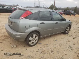 2006 Ford Focus S with VIN 1FAHP37N76W180039, listed as a Copart auction lot 58328565 with 220,696 mi miles and Salvage title. Bid and sale history available at DreamBid. Image 3.