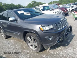 2015 Jeep Grand Cherokee Overland with VIN 1C4RJFCG0FC698603, listed as a IAAI auction lot 42789847 with 146,302 mi miles and . Bid and sale history available at DreamBid. Image 1.