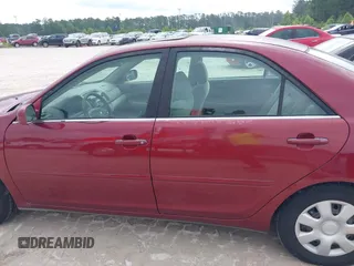2002 Toyota Camry LE z VIN 4T1BE30K32U110304, wystawiony jako IAAI lot #42357455 z przebiegiem 221 389 mil mil oraz . Historia ofert i sprzedaży dostępna na DreamBid. Obrazek 14.