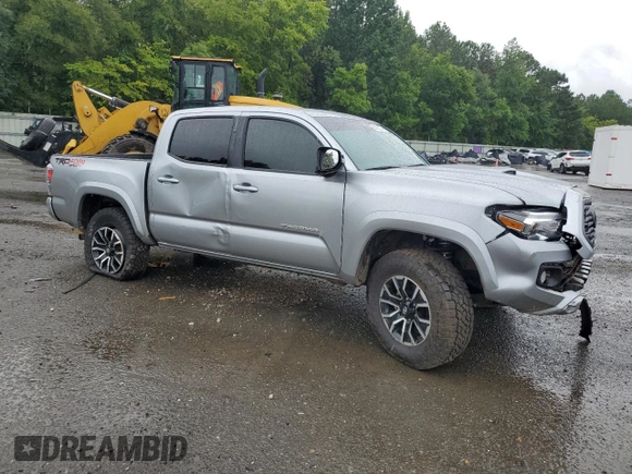 2023 Toyota Tacoma SR with VIN 3TMCZ5AN4PM566647, listed as a Copart auction lot 64062034 with 43,154 mi miles and Salvage title. Bid and sale history available at DreamBid. Image 4.