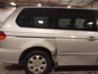 2004 Honda Odyssey EX-L with VIN 5FNRL18974B127696, listed as a IAAI auction lot 41643243 with 200,286 mi miles and . Bid and sale history available at DreamBid. Image 21.