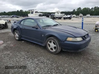 2003 Ford Mustang Standard with VIN 1FAFP40453F452999, listed as a Copart auction lot 57884325 with 135,463 mi miles and Salvage title. Bid and sale history available at DreamBid. Image 4.