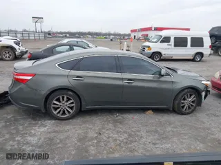 2014 Toyota Avalon Limited with VIN 4T1BK1EB0EU084433, listed as a IAAI auction lot 41434826 with 166,964 mi miles. Bid and sale history available at carsss.com. Image 14.