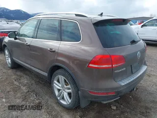 2013 Volkswagen Touareg Lux with VIN WVGEF9BP1DD012851, listed as a IAAI auction lot 41732391 with 123,283 mi miles and . Bid and sale history available at DreamBid. Image 3.