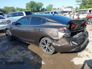2016 Nissan Maxima Platinum z VIN 1N4AA6AP3GC385276, wystawiony jako IAAI lot #42547410 z przebiegiem 100 307 mil mil oraz . Historia ofert i sprzedaży dostępna na DreamBid. Obrazek 3.