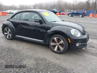 2012 Volkswagen Beetle 2.0T Turbo with VIN 3VWV67ATXCM663788, listed as a IAAI auction lot 41111055 with 152,454 mi miles. Bid and sale history available at carsss.com. Image 1.