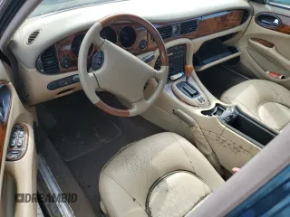 1999 Jaguar XJ with VIN SAJKX6047XC861227, listed as a Copart auction lot 75007414 with Not provided miles and Salvage title. Bid and sale history available at DreamBid. Image 8.